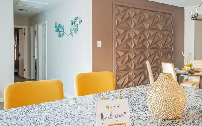 Granite counter with a thank-you card staged for arriving guests