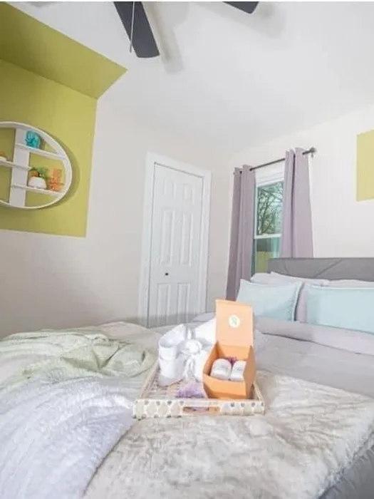 Guest bedroom with welcome tray staged on fresh bedding